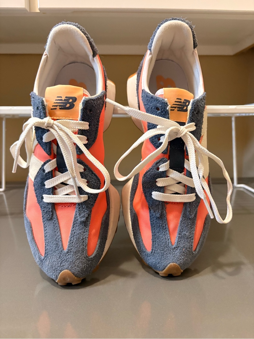 Woman’s New Balance Orange & Navy Suede Accent Sneakers